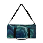 Teal swirl Printify duffel bag with ocean abstract design, perfect for travel or gym use, showing its spacious shape and vibrant print.