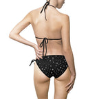 Starry Night black tie-side bikini with all-over star print, featuring adjustable sides and vibrant celestial design.